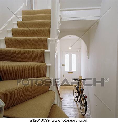 Stock Photo - Cream carpet on staircase in white hall. Fotosearch