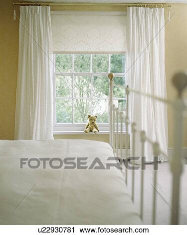 Cream curtains and blind on window in cream country bedroom View Large Photo Image Stock Image - Cream curtains and blind on window in cream country bedroom. Fotosearch
