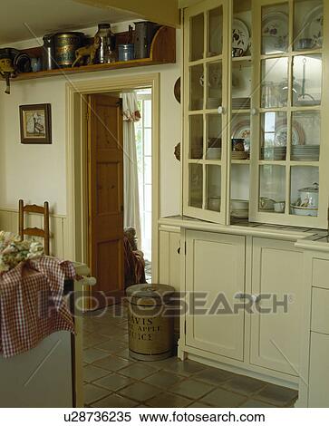 Cream dresser with glazed doors in country kitchen View Large Photo Image Stock Photography - Cream dresser with glazed doors in country kitchen. Fotosearch
