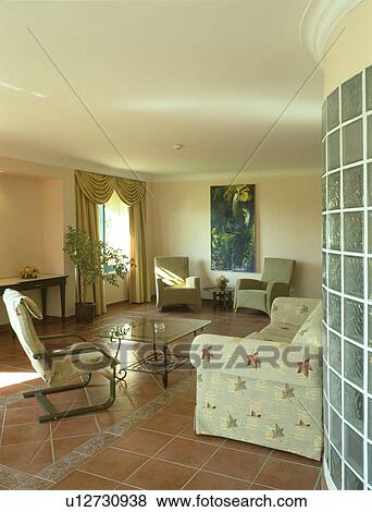 Cream sofa and chairs in modern living room with terracotta tiled floor View Large Photo Image Stock Photo - Cream sofa and chairs in modern living room with terracotta tiled floor. Fotosearch