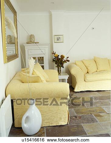 Cream sofas in white traditional living room with tiled floor View Large Photo Image Stock Photograph - Cream sofas in white traditional living room with tiled floor. Fotosearch