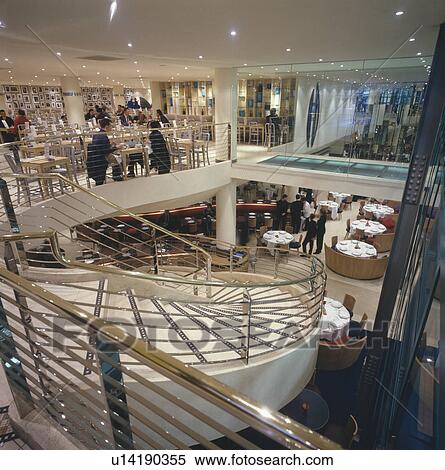 Curved staircase in modern London restaurant designed by Terence Conran View Large Photo Image Stock Photography - Curved staircase in modern London restaurant designed by Terence Conran. Fotosearch