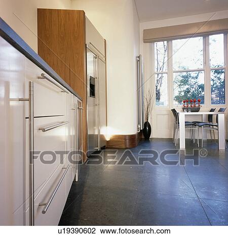 Dark grey flooring in modern kitchen dining room View Large Photo Image Stock Image - Dark grey flooring in modern kitchen dining room. Fotosearch