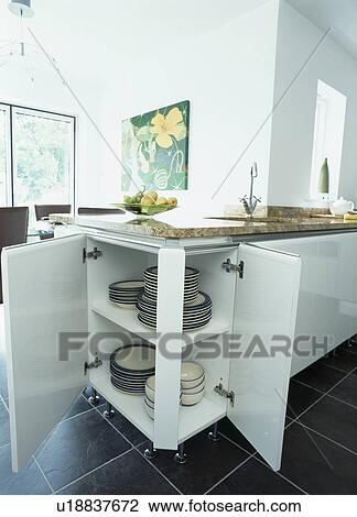 Doors open on storage cupboard in modern kitchen View Large Photo Image Stock Image - Doors open on storage cupboard in modern kitchen. Fotosearch