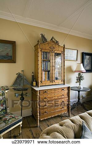 Faux bamboo antique secretaire in traditional living room View Large Photo Image Stock Image - Faux bamboo antique secretaire in traditional living room. Fotosearch