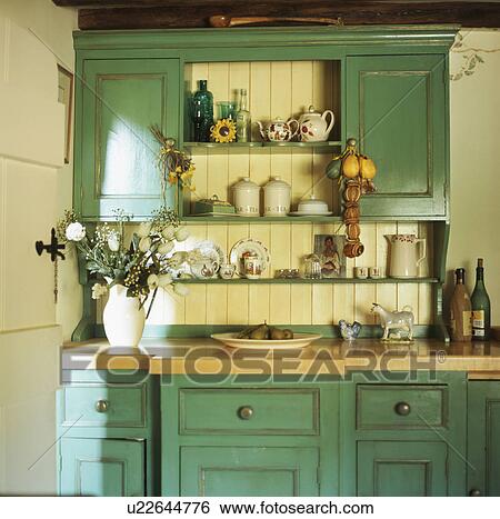 Fitted Turquoise Dresser In Cream Kitchen Stock Photograph