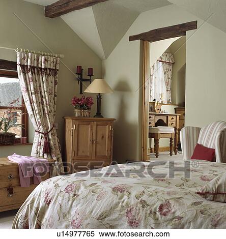 Floral bedlinen on bed in country cottage bedroom View Large Photo Image Stock Photography - Floral bedlinen on bed in country cottage bedroom. Fotosearch