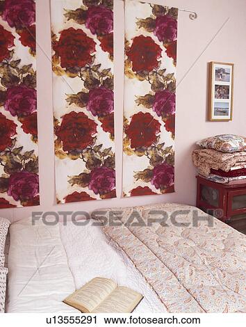 Floral fabric panels on wall above bed with white linen and cream quilt View Large Photo Image Stock Image - Floral fabric panels on wall above bed with white linen and cream quilt. Fotosearch