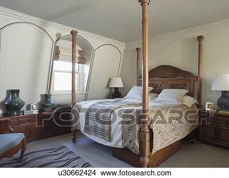 Four-poster bed in white country bedroom View Large Photo Image Picture - Four-poster bed in white country bedroom. Fotosearch