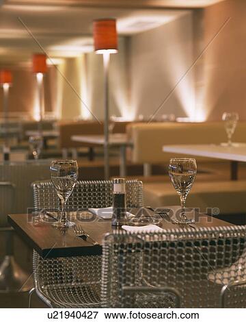 Glasses of wine on table in modern city restaurant View Large Photo Image Stock Photo - Glasses of wine on table in modern city restaurant. Fotosearch