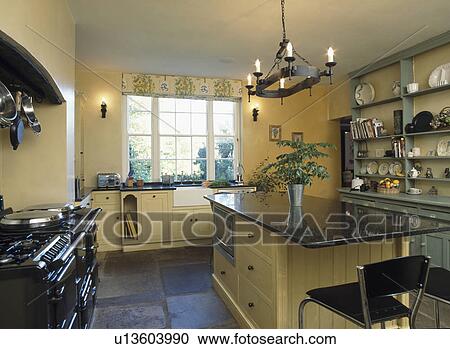 Granite worktop on island unit in modern kitchen with slate flooring View Large Photo Image Stock Image - Granite worktop on island unit in modern kitchen with slate flooring. Fotosearch