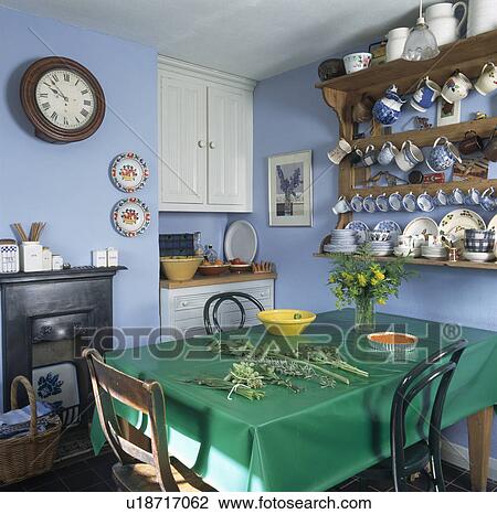 Green cloth on table in pastel blue dining room View Large Photo Image Stock Image - Green cloth on table in pastel blue dining room. Fotosearch