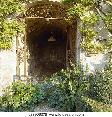 Green plants growing in front of open doorway with metal gates View Large Photo Image Stock Photography - Green plants growing in front of open doorway with metal gates. Fotosearch