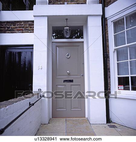 Stock Image - Grey front door of traditional townhouse. Fotosearch