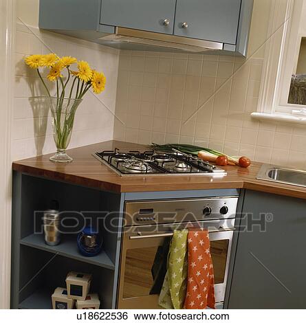 Hob and oven in fitted corner unit in modern kitchen View Large Photo Image Stock Photograph - Hob and oven in fitted corner unit in modern kitchen. Fotosearch