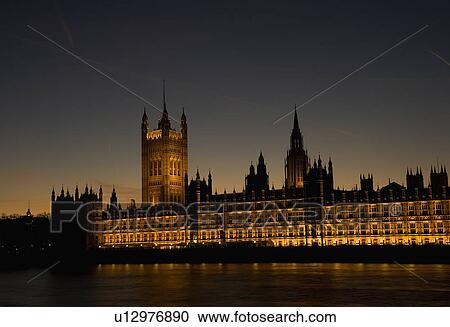 Houses of Parliament on the Thames in London at night. View Large Photo Image Stock Image - Houses of Parliament on the Thames in London at night.. Fotosearch