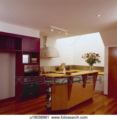 Island unit in modern architectural kitchen with wooden flooring View Large Photo Image Stock Image - Island unit in modern architectural kitchen with wooden flooring. Fotosearch