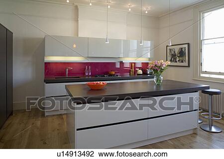 Island unit with cast concrete resin worktop in modern kitchen with white gloss lacquer units View Large Photo Image Stock Image - Island unit with cast concrete resin worktop in modern kitchen with white gloss lacquer units. Fotosearch