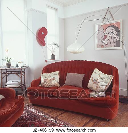 Large floor lamp and red velour sofa in modern living room with red wall light and modern picture View Large Photo Image Stock Photo - Large floor lamp and red velour sofa in modern living room with red wall light and modern picture. Fotosearch