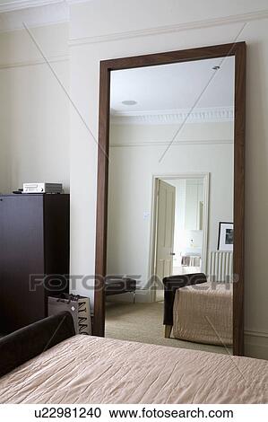 Large mirror in modern bedroom View Large Photo Image Stock Image - Large mirror in modern bedroom. Fotosearch