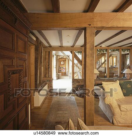 Stock Photo - Large wooden beams in living room in barn conversion. Fotosearch