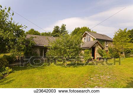 Lawn in garden of country cottage with small extension View Large Photo Image Stock Image - Lawn in garden of country cottage with small extension. Fotosearch