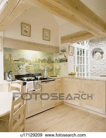 Limed Wooden Floor And Ed Units In Cream Country Kitchen With Aga Oven Stock Photo U17129209 Fotosearch Limed Wooden Floor And Ed Units In