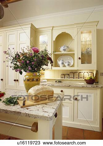 Loaf of bread on island unit in cream country table View Large Photo Image Stock Image - Loaf of bread on island unit in cream country table. Fotosearch