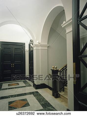 Marble floor tiles in large traditional townhouse hall View Large Photo Image Stock Image - Marble floor tiles in large traditional townhouse hall. Fotosearch