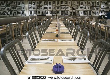 Metal chairs and pale wood tables in modern London restaurant View Large Photo Image Stock Image - Metal chairs and pale wood tables in modern London restaurant. Fotosearch