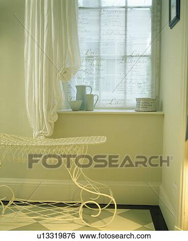 Stock Photograph - Metal table in traditional white hall. Fotosearch