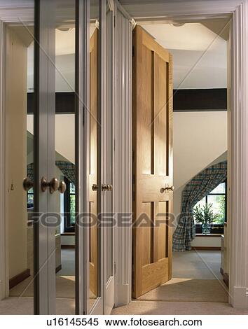 Stock Photography - Mirrored doors in small hall. Fotosearch