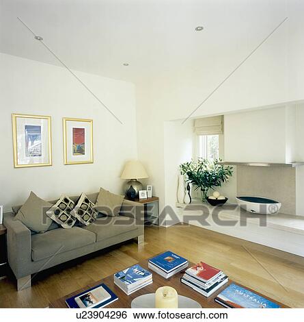 Modern fire-bowl in fireplace in white living room with beige sofa View Large Photo Image Stock Photograph - Modern fire-bowl in fireplace in white living room with beige sofa. Fotosearch