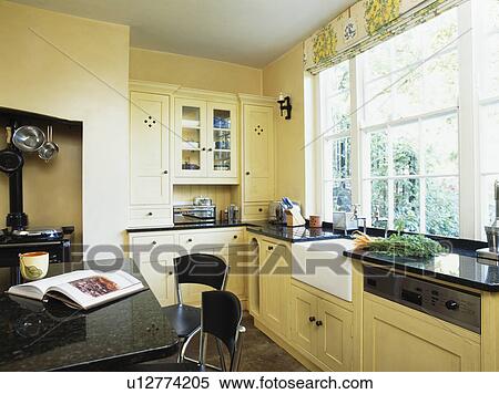 Modern kitchen with granite-topped island unit View Large Photo Image Stock Photography - Modern kitchen with granite-topped island unit. Fotosearch