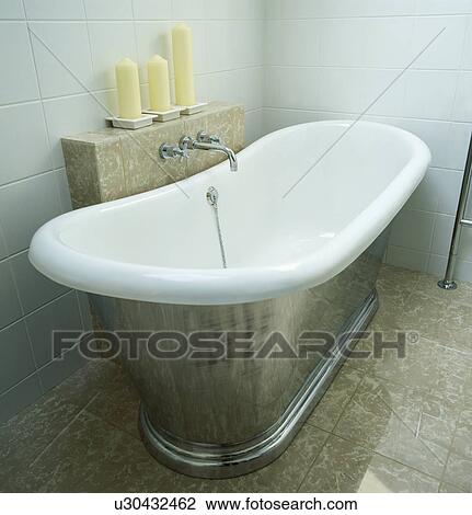 Modern slipper bath in modern white tiled bathroom View Large Photo Image Stock Image - Modern slipper bath in modern white tiled bathroom. Fotosearch