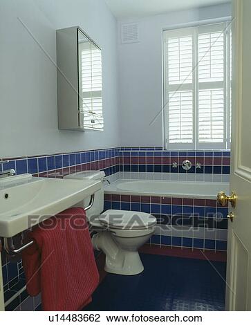 Modern white bathroom with blue and pink tiles View Large Photo Image Stock Image - Modern white bathroom with blue and pink tiles. Fotosearch