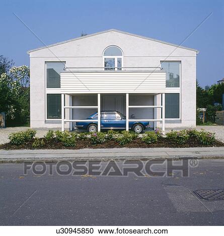 Stock Image - Modern white house with integral car-port. Fotosearch