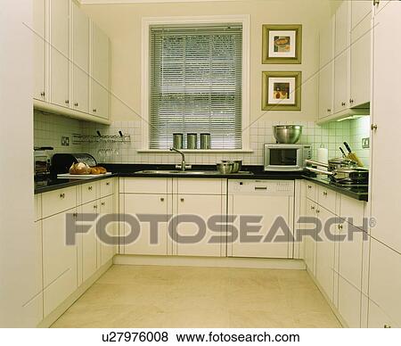 Modern white townhouse kitchen View Large Photo Image Stock Photo - Modern white townhouse kitchen. Fotosearch
