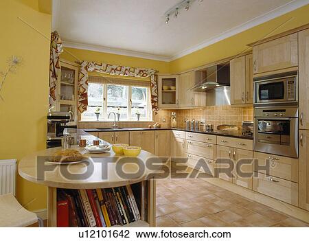 Modern yellow kitchen with quarry-tiled floor View Large Photo Image Stock Image - Modern yellow kitchen with quarry-tiled floor. Fotosearch
