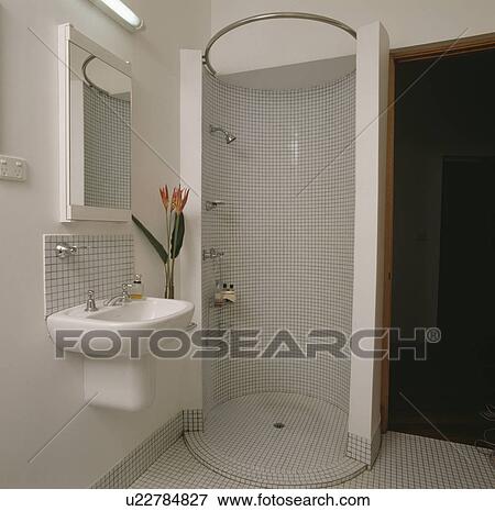 Mosaic tiled circular shower cabinet in modern white bathroom View Large Photo Image Stock Photo - Mosaic tiled circular shower cabinet in modern white bathroom. Fotosearch
