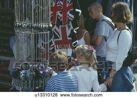 Mother and children outside market stall in Camden Town in London View Large Photo Image Stock Photo - Mother and children outside market stall in Camden Town in London. Fotosearch