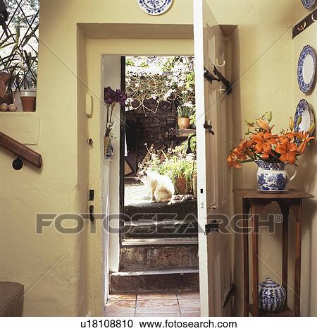 Open front door in white cottage hall View Large Photo Image Stock Image - Open front door in white cottage hall. Fotosearch