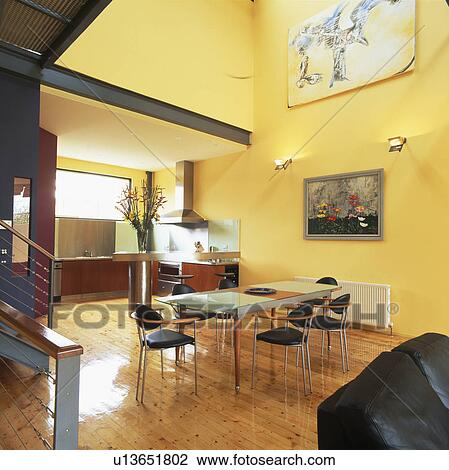 Open-plan yellow kitchen dining room with wooden flooring View Large Photo Image Stock Image - Open-plan yellow kitchen dining room with wooden flooring. Fotosearch
