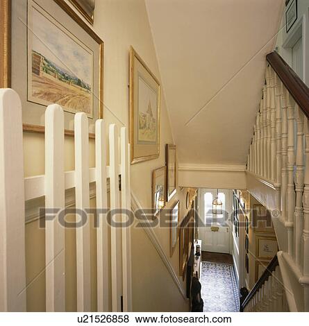 Open security gate at the top of staircase in traditional townhouse View Large Photo Image Stock Photo - Open security gate at the top of staircase in traditional townhouse. Fotosearch