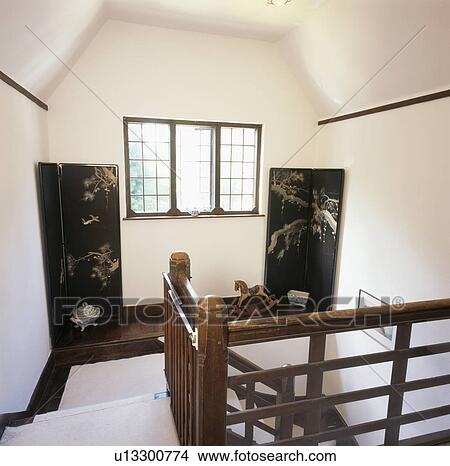 Oriental screens on shelf above staircase in country house View Large Photo Image Picture - Oriental screens on shelf above staircase in country house. Fotosearch
