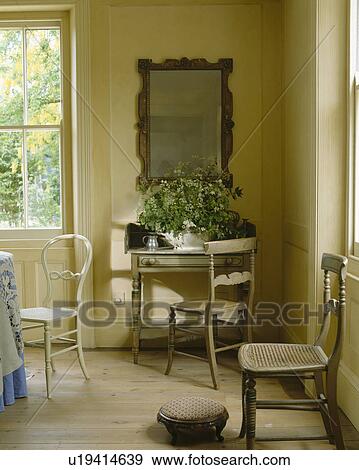 Painted Antique Chairs And Wooden Flooring In Regency Dining Room Stock Photo U19414639 Fotosearch