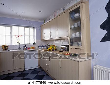 Pale wood fitted units in modern pasgtel blue kitchen View Large Photo Image Stock Photograph - Pale wood fitted units in modern pasgtel blue kitchen. Fotosearch