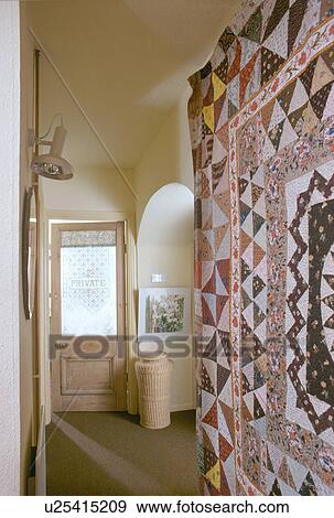 Patchwork quilt on wall of small seventies townhouse hall View Large Photo Image Stock Photo - Patchwork quilt on wall of small seventies townhouse hall. Fotosearch