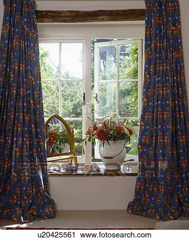 Patterned blue full-length curtains at cottage window View Large Photo Image Stock Image - Patterned blue full-length curtains at cottage window. Fotosearch