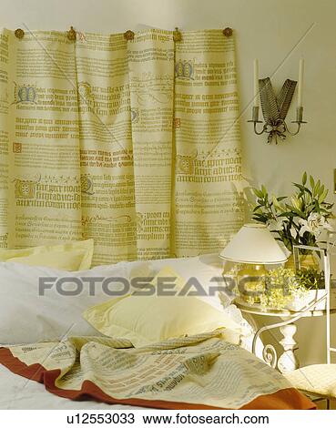 Patterned cotton hanging on wall behind bed with white pillows View Large Photo Image Stock Image - Patterned cotton hanging on wall behind bed with white pillows. Fotosearch
